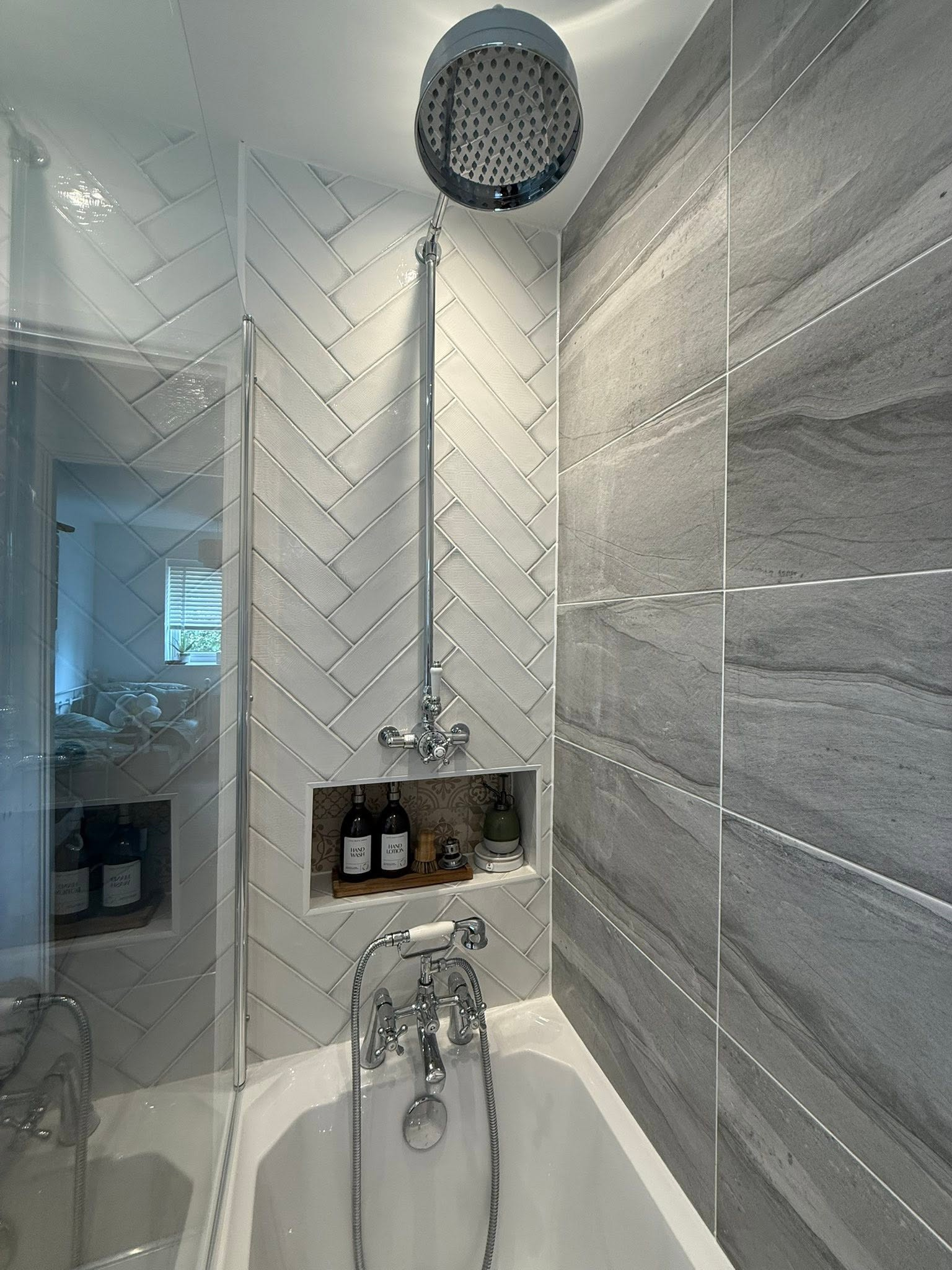 Chrome shower and detailed bathroom tiling