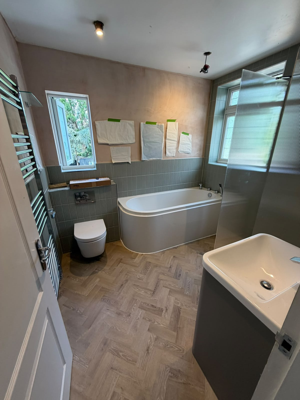Bathroom refurbishment in progress with bath and shower