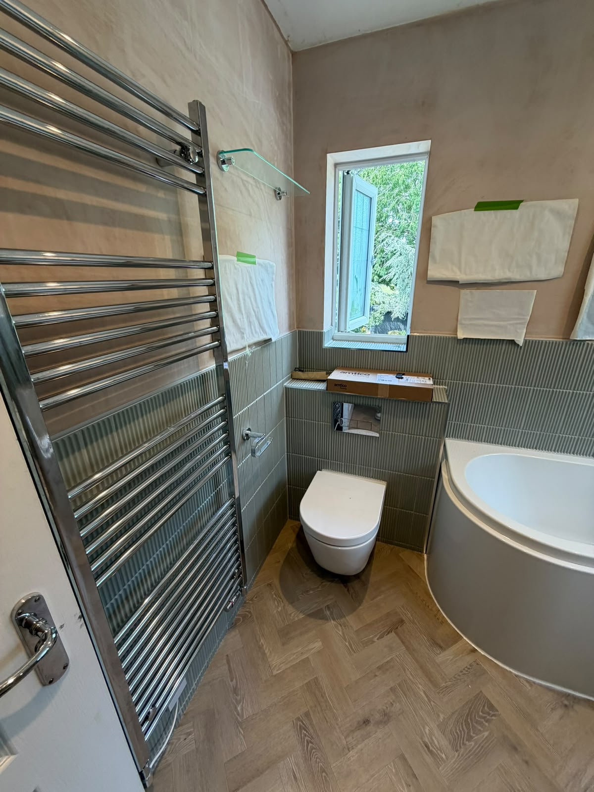 Bathroom refurbishment with wall-hung toilet and bath