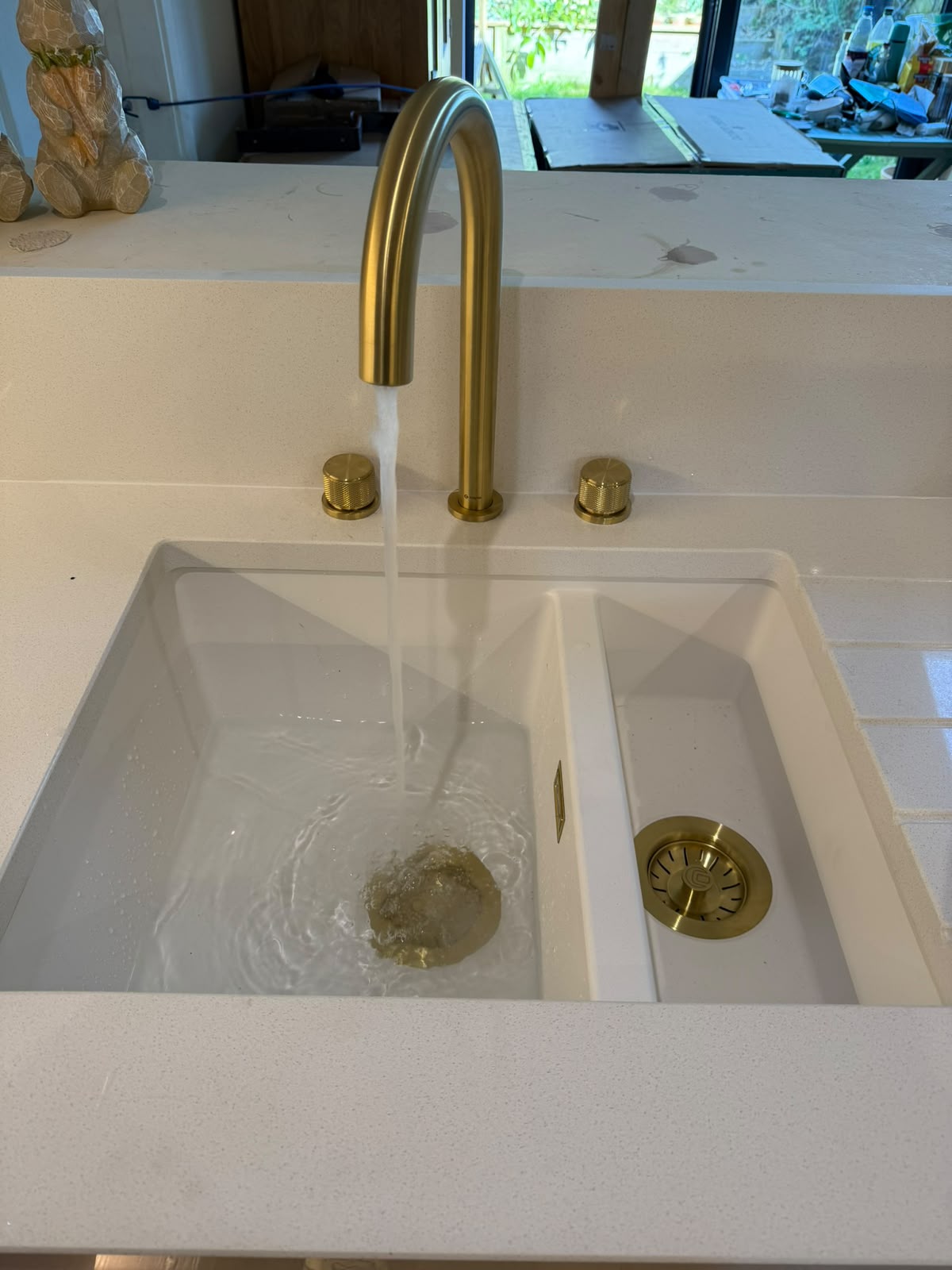 Brushed brass kitchen tap and double sink